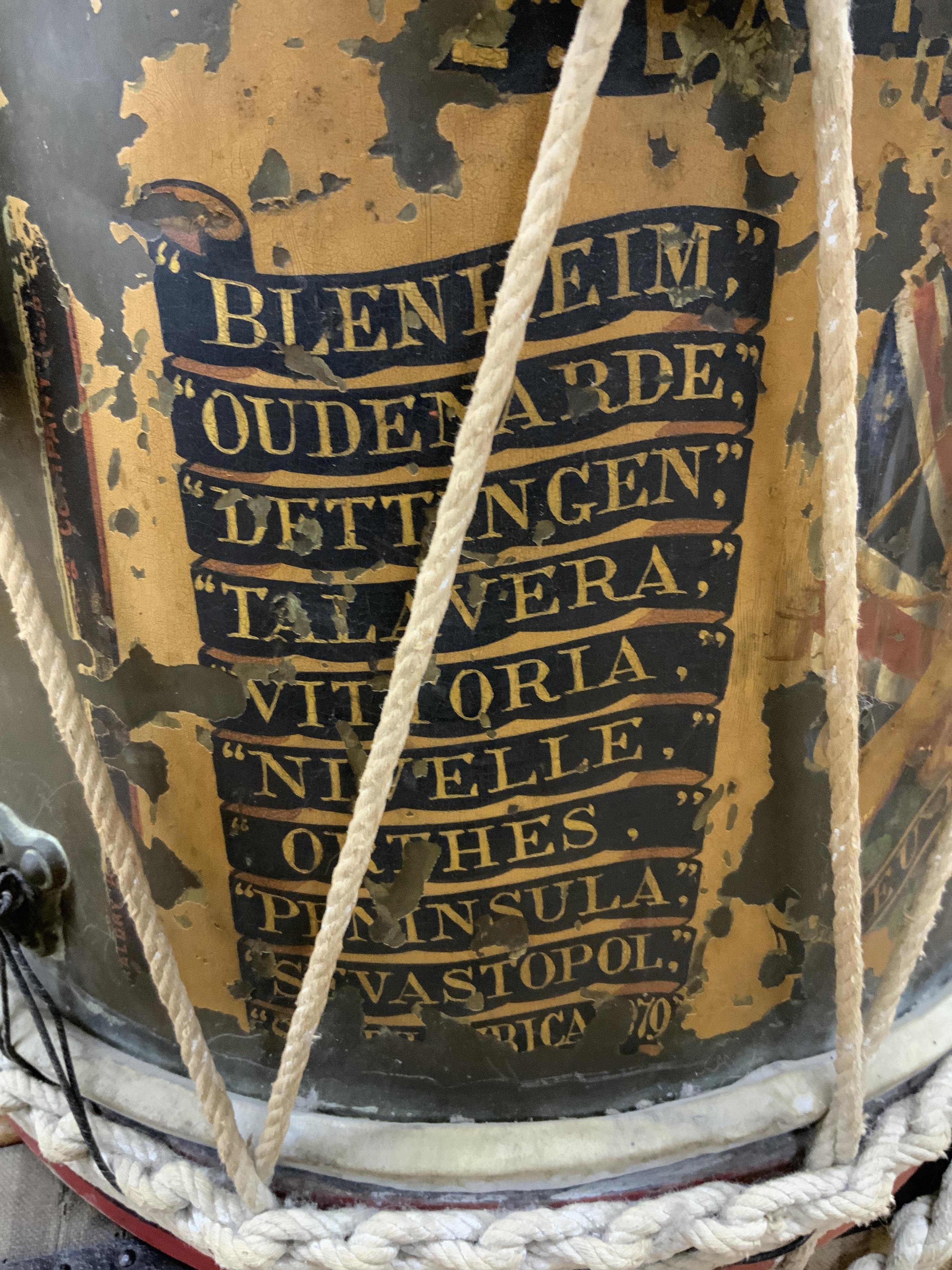 A late 19th/early 20th century Royal East Kent Regiment 'Buffs' regimental drum, 37cm diameter, 37cm high, together with a rope edged, stained pine removable 'table top' adaption